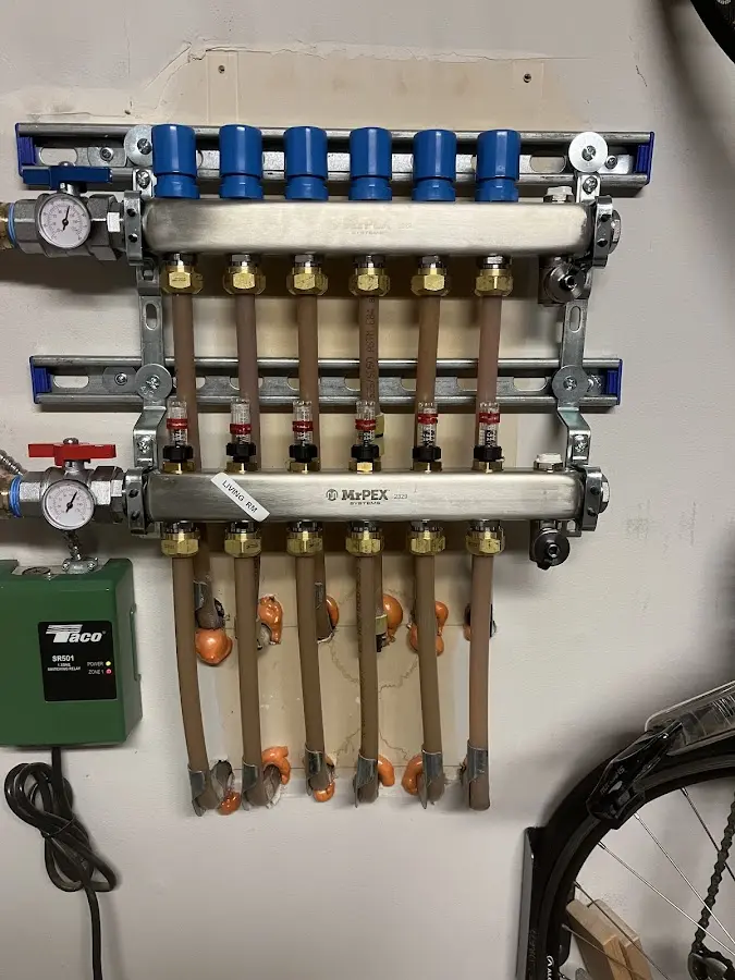 Plumber performing Water Heater Repair at a residential property in Laconia